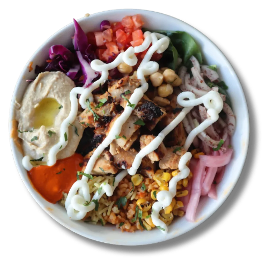 Chicken shawarma bowl with corn, pickled onion, hummus and garlic toum